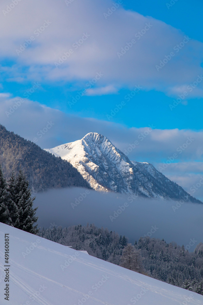 Sunny winter landscape with snowy alpine peaks and snowy nature. Dachstein Glacier, Styria, Austria