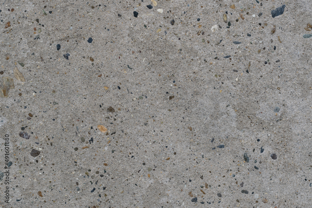 Texture of clean and flat concrete surface. Monolithic concrete wall or floor with inclusion of multicolored pebbles, high resolution. Texture of clean and flat concrete surface. Monolithic concrete wall or floor with inclusion of multicolored pebbles, high resolution.