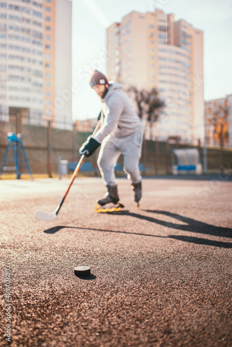 Photography Hockey player training outside without ice - summer hockey training dribbling th