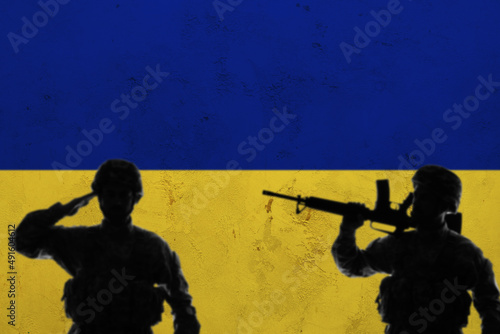 Silhouette of soldiers against Ukrainian flag. War in Ukraine