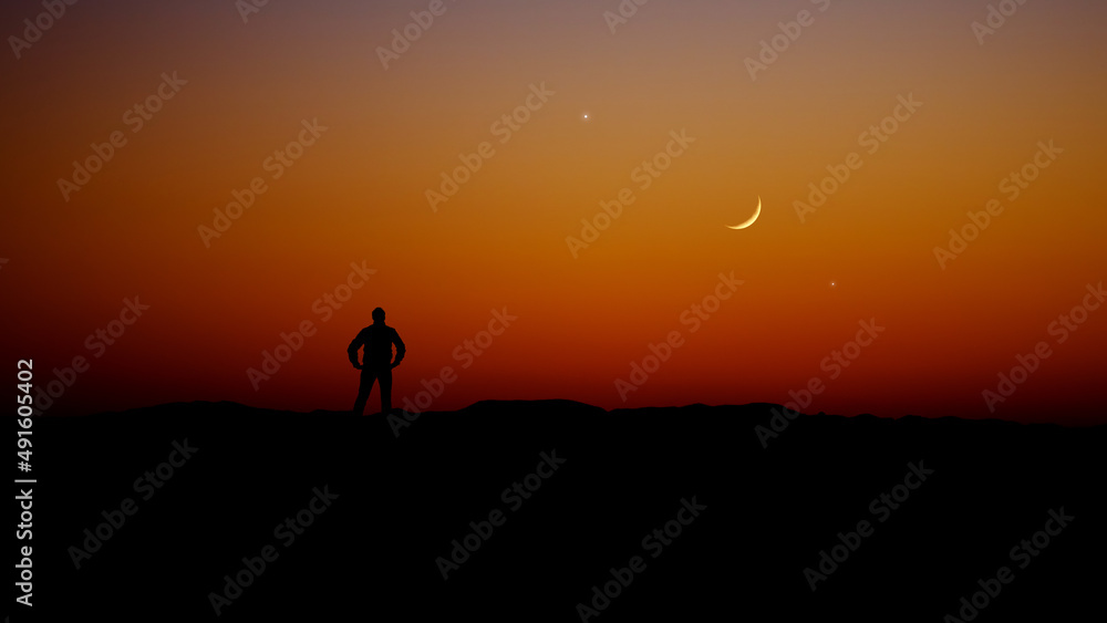 Man observing evening sky with stars, planets and crescent Moon.