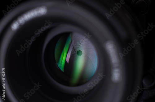 Camera lens close-up on white background