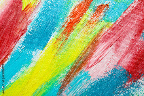 Strokes of colorful acrylic paints on canvas, closeup