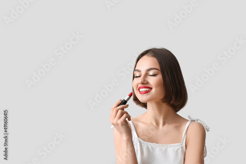 Happy woman with closed eye...