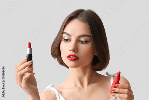 Beautiful woman holding red...