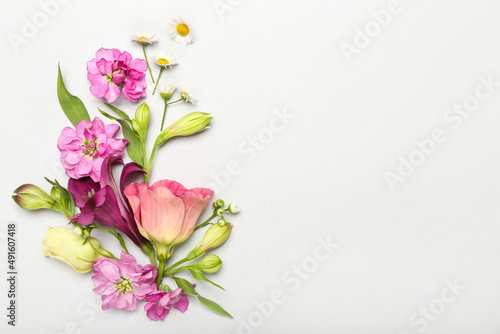 Composition with different beautiful flowers on white background