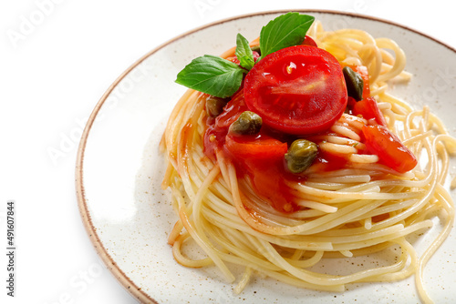 Plate with delicious Pasta Puttanesca on white background, closeup