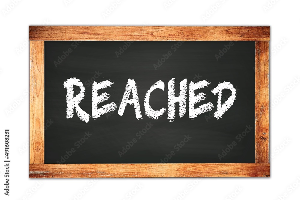 REACHED text written on wooden frame school blackboard. REACHED text written on wooden frame school blackboard.