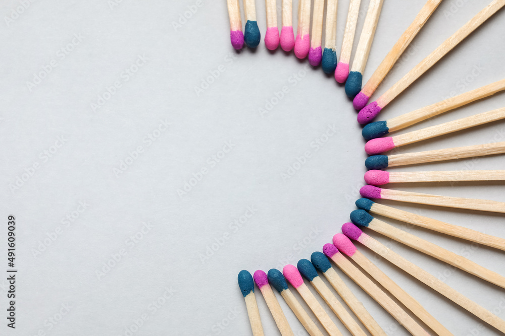 Different new matchsticks on grey background Different new matchsticks on grey background