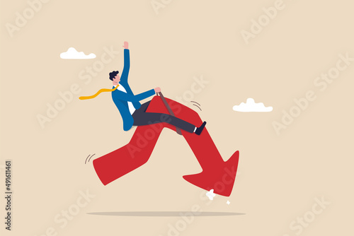 Stock market or crypto currency crash and going down, economic crisis or investing risk, volatility and fluctuation concept, businessman investor rodeo riding uncertainty decline red arrow graph.