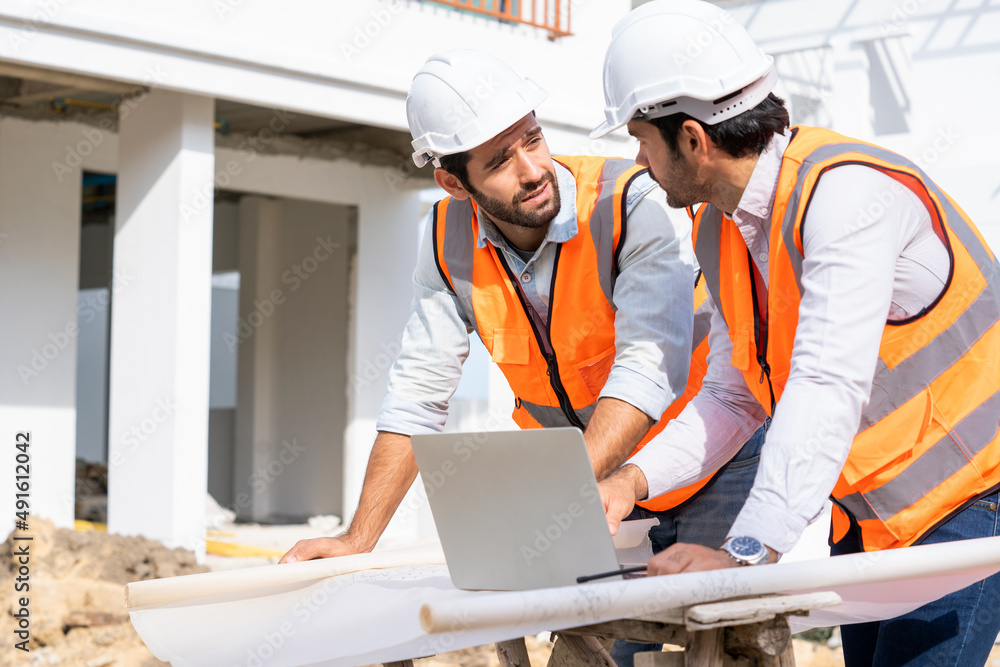 Team of engineers working at construction site,Engineering construction teamwork concept. Team of engineers working at construction site,Engineering construction teamwork concept.