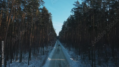 the car rides in the winter forest in extreme cold