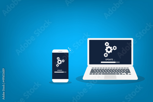 Wallpaper Mural Laptop and smartphone with update process screen. Install new software, operating system support. Torontodigital.ca