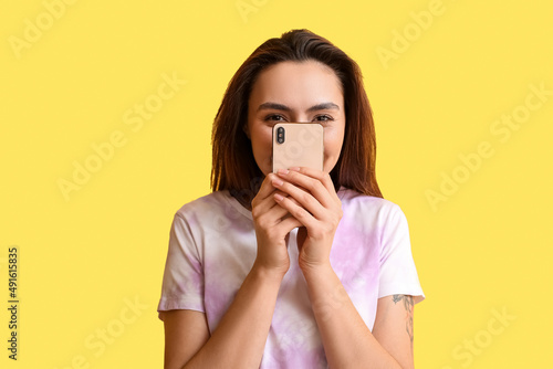 Woman closing face with mod...