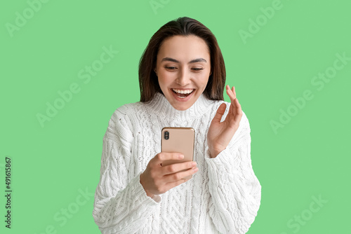 Excited young woman reactin...