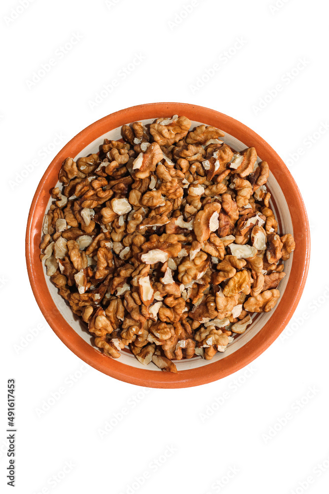 Plate with walnut grains isolated on white background. Plate with walnut grains isolated on white background.
