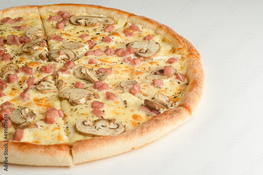 Pizza with ham, mushrooms, oregano and cheese, on a white background