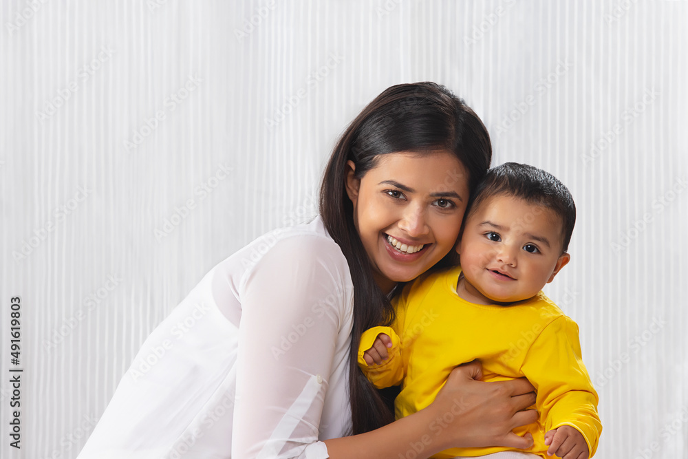 Portrait of happy mother with her little baby at home Portrait of happy mother with her little baby at home