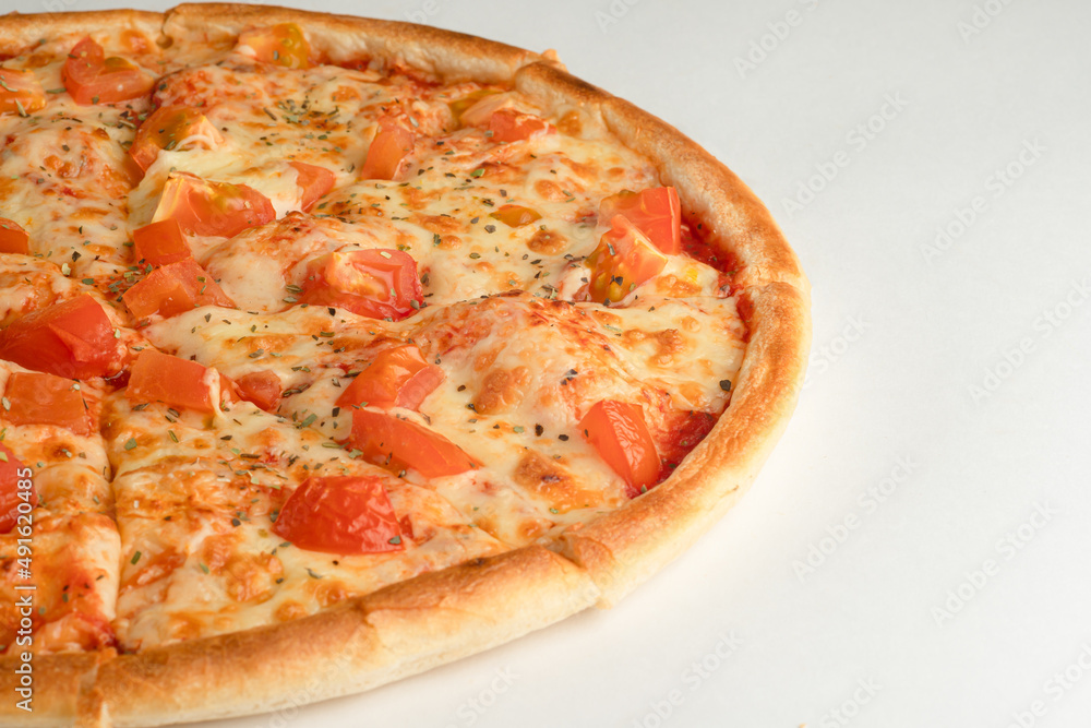 Pizza with tomatoes, oregano and cheese on a white background Pizza with tomatoes, oregano and cheese on a white background