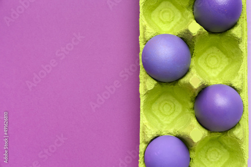 Purple easter eggs in green...