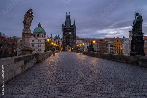 Dreamy night view. Early morning on the Charles Bridge in the Old Town of amazing historic city Prague, Czech Republic, Europe.