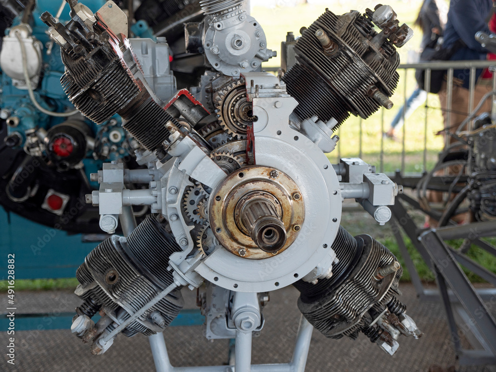 Fototapeta premium Old aircraft engine with wood propeller, vintage plane close up