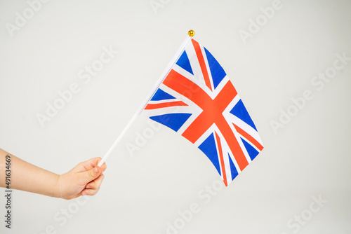Leinwand Poster British hand flag waving on white background