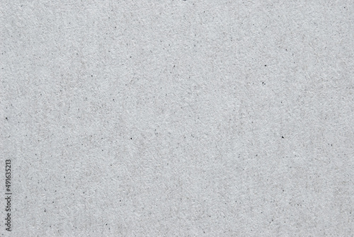 A sheet of gray recycled cardboard texture as background