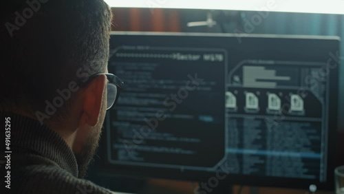 The hacker launched his network virus. His program code is working, and he is happy to finish the success work successful.