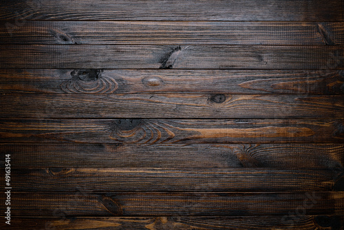 Dark wood texture. Stained wood background.