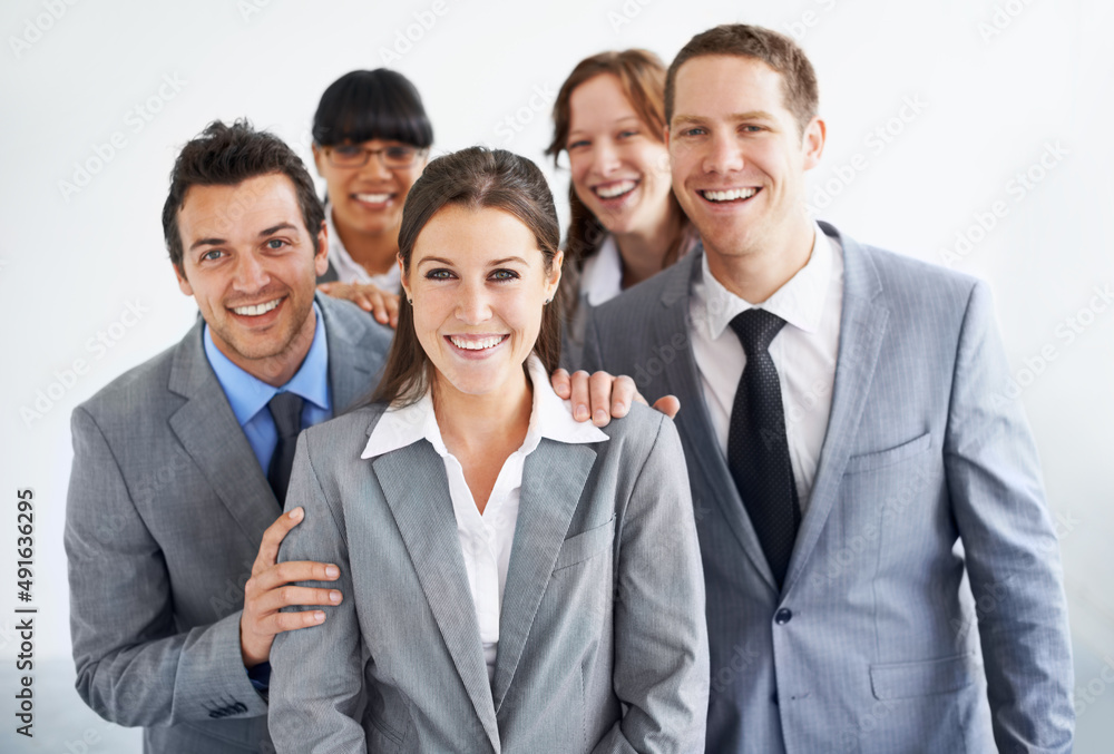 Shes an invaluable asset to the team. A group of businesspeople standing proudly with their leader. Shes an invaluable asset to the team. A group of businesspeople standing proudly with their leader.