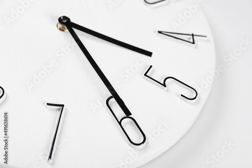 Stylish analog clock on white background, closeup
