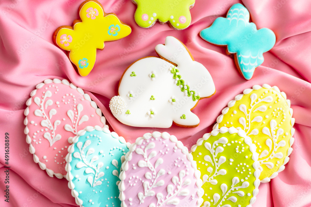 background banner greeting card for Happy Easter with set colorful eggs, Easter bunny rabbit gingerbread cookies on pink silk fabric background background banner greeting card for Happy Easter with set colorful eggs, Easter bunny rabbit gingerbread cookies on pink silk fabric background