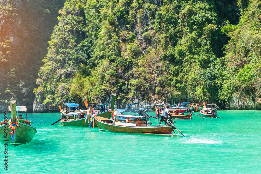 Long tail boat at Pileh lagoon on Phi Phi island, Krabi, Thailand. landmark, destination Southeast Asia Travel, vacation and holiday concept