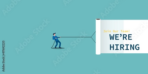 Businessman pulling white curtain with the text we are hiring. Business recruiting design concept