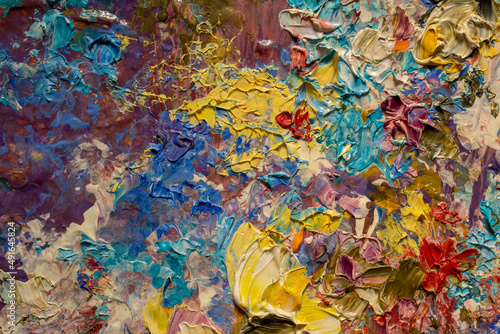 Abstract multicolored background made with acrylic paints. Colored volumetric strokes in a chaotic manner. Blurred image.