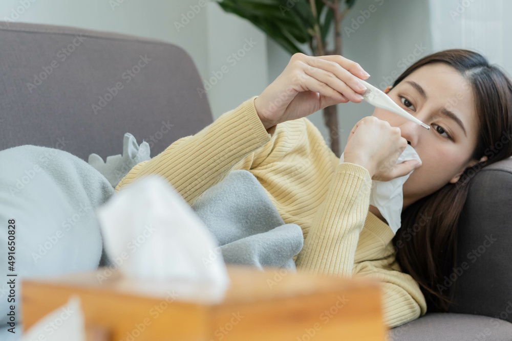 Sick, Coronavirus covid19 asian young woman, girl headache lying under