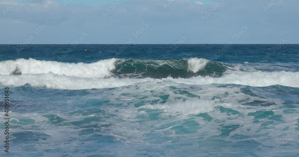 Crashing wave coming straight in with seaspray patterns and horizon in slow motion Crashing wave coming straight in with seaspray patterns and horizon in slow motion