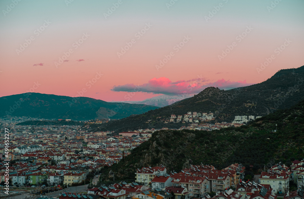 Fethiye turkey town top view, city scape, mountain town, sunset sky and clouds