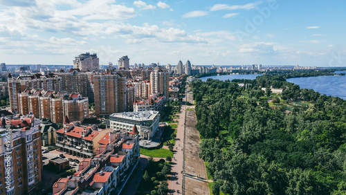 Area with residential buildings, waterfront, pedestrian and park area. Cityscape