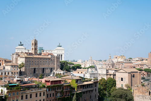 View of the city of Rome on a beautiful sunny day. Cityscape with architecture, church towers and old buildings. Photo taken in Rome, Italy.