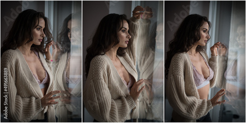 Obraz na płótnie Attractive sexy brunette in white bra and brown sweater posing provocatively, near a window,studio shot. Portrait of sensual woman with long hair, in classic boudoir scene , looked out the window w salonie