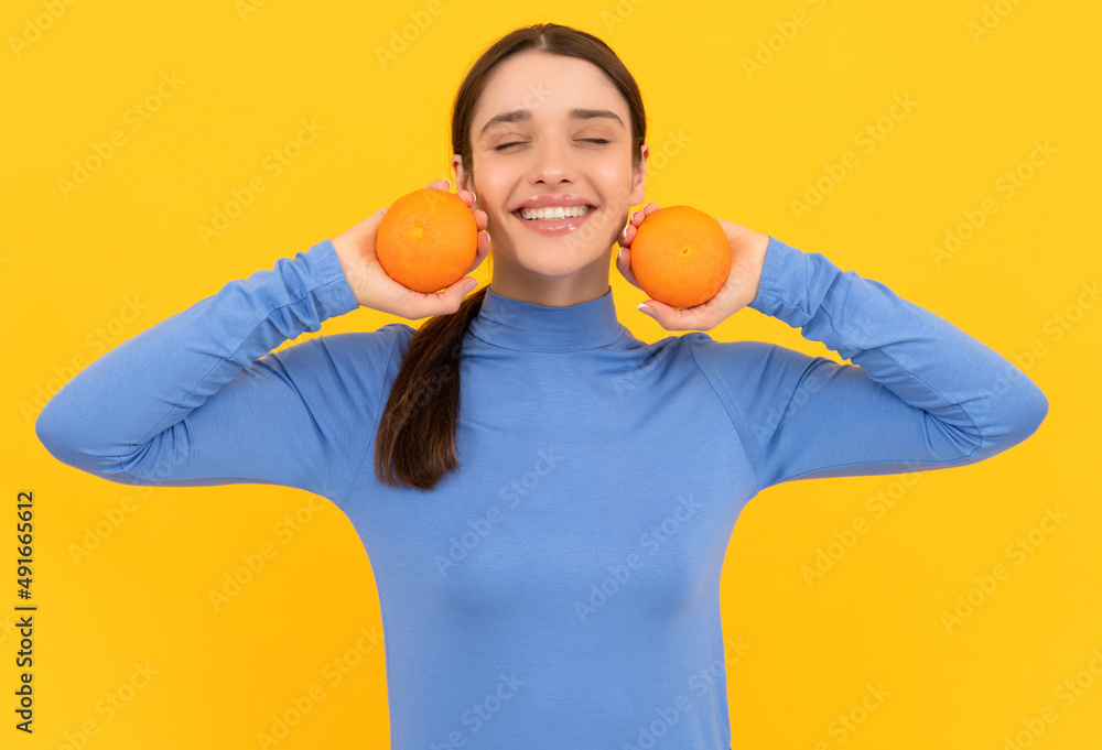 health by natural organic fresh grapefruit. diet and skin beauty. happy girl with orange health by natural organic fresh grapefruit. diet and skin beauty. happy girl with orange