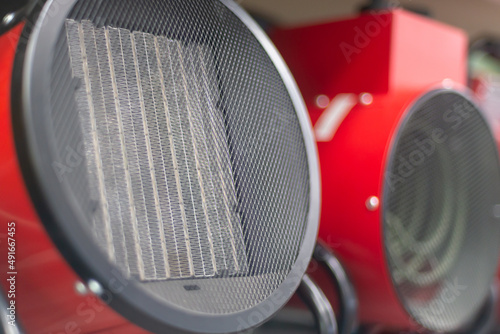 Red fan heater for heating rooms and premises.