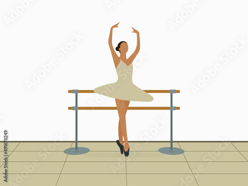 Ballerina dancing near the ballet barn indoors