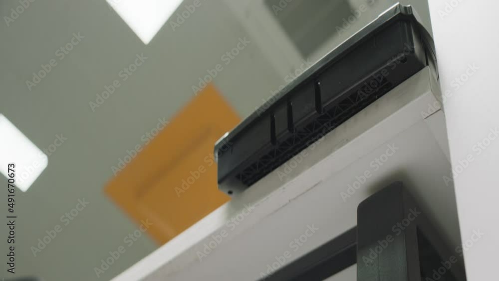 Shredder. Paper destroying machine. Process of paper cutting in the office. Low angle camera Shredder. Paper destroying machine. Process of paper cutting in the office. Low angle camera