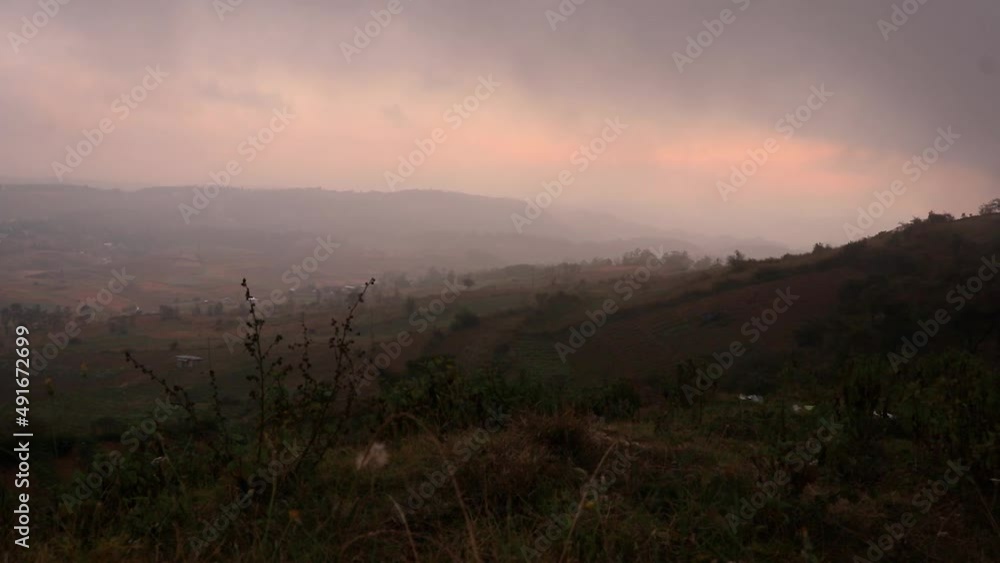 dramatic cloud movement with sunset sky at mountain valley at evening from hill top video is taken at badda peak shillong meghalaya india. dramatic cloud movement with sunset sky at mountain valley at evening from hill top video is taken at badda peak shillong meghalaya india.
