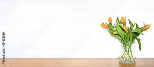 Yelow tulips on white background with copy space. Banner for website. © dominikab