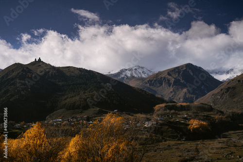 Fototapeta Naklejka Na Ścianę i Meble -  Breathtaking mountain view in Georgia. Caucasus mountains. Hiking in beautiful nature of snowy peaks.  