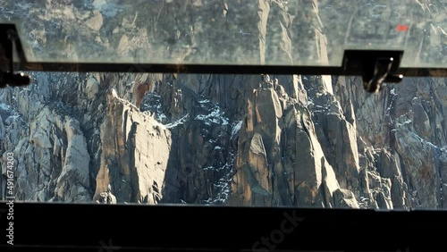 View through Aiguille du Midi cable car window in Chamonix, France.